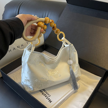 包包2025春夏单肩腋下包大容量通勤手提水桶包丝绒材质气质熟女