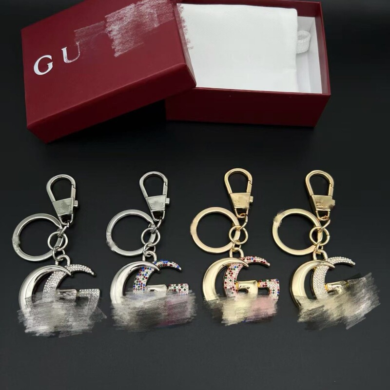 Gucci Double g Keychain Pendant, Available in Silver/Gold, Classic Gg Logo, Diamond-Encrusted Design