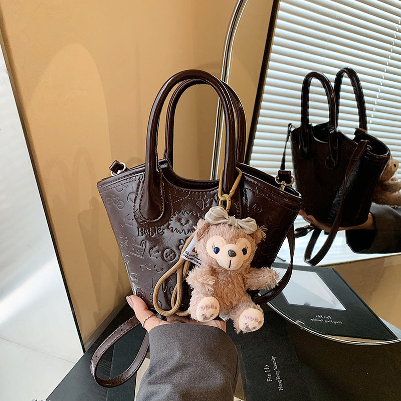 Nicho coreano bolsas de cesta de verduras de mano primavera de mujeres 2025 nueva moda encantadora bolsa en relieve bolsas de mochila