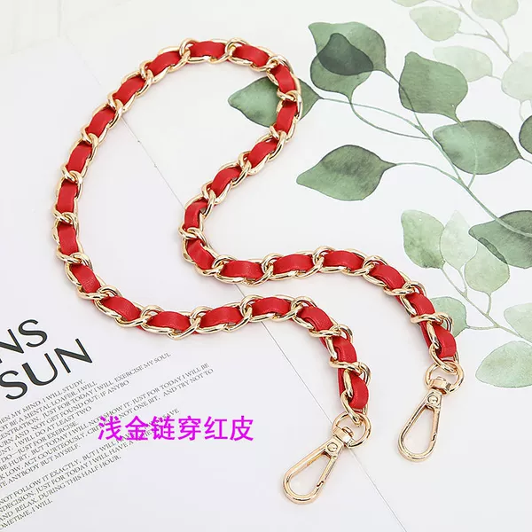 Light gold chains in red leather