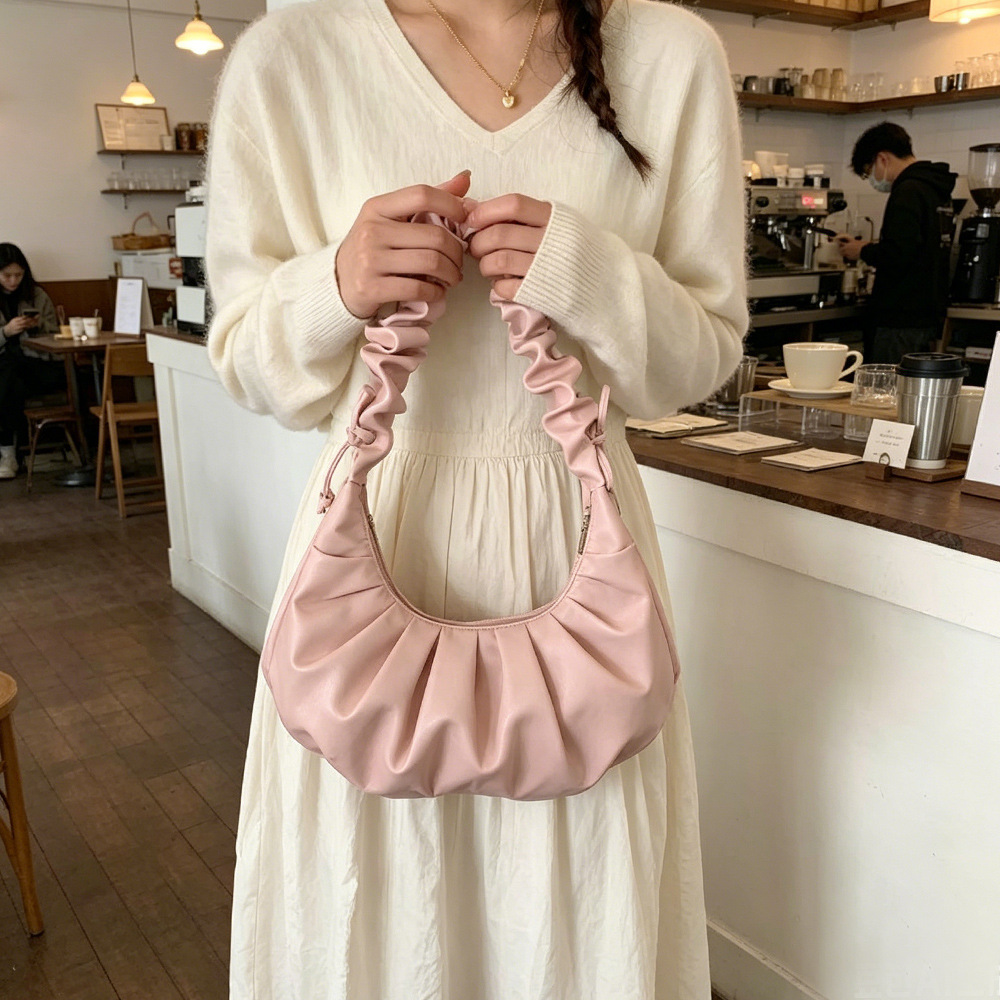 2026 nuevo estilo de mujer bolso de estilo extranjero bolso de moda alta sensación de nube bolso de hombro viento dulce simple plegado