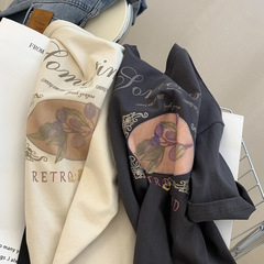 アメリカのレトロな花のアルファベットのプリントの丸首の半袖のtシャツの女性の夏はゆったりしていて痩せています。