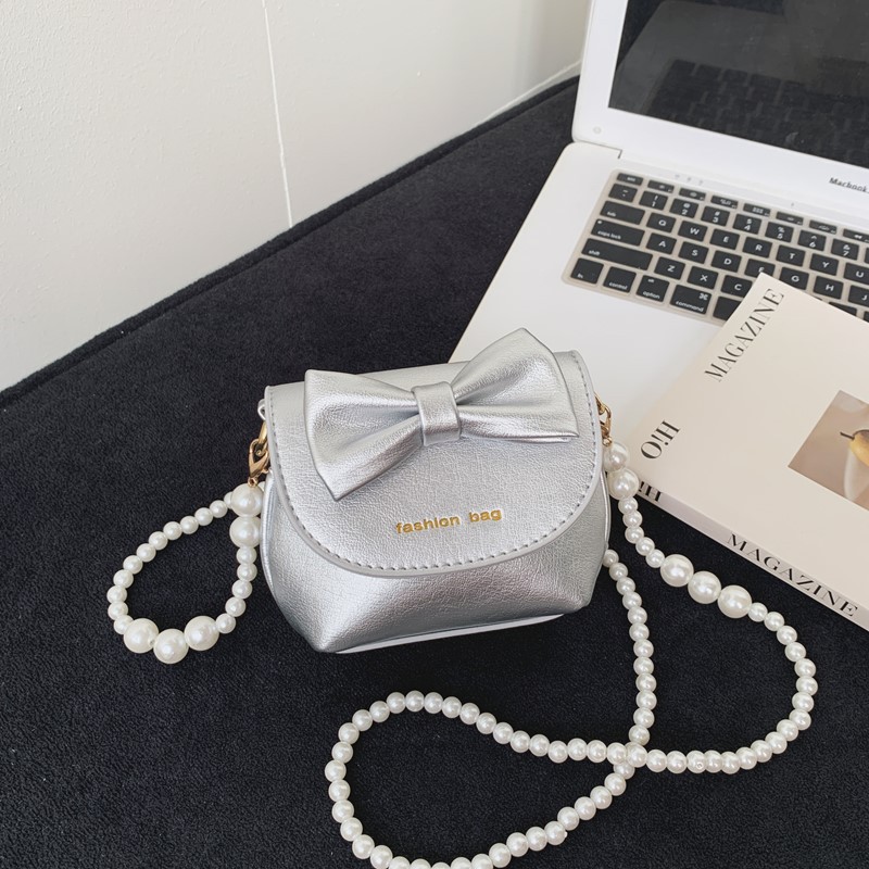 Cute mini niñas bolso de hombro dulce perla bolso de bebé coreano nuevo bolso de cambio de color sólido para niños