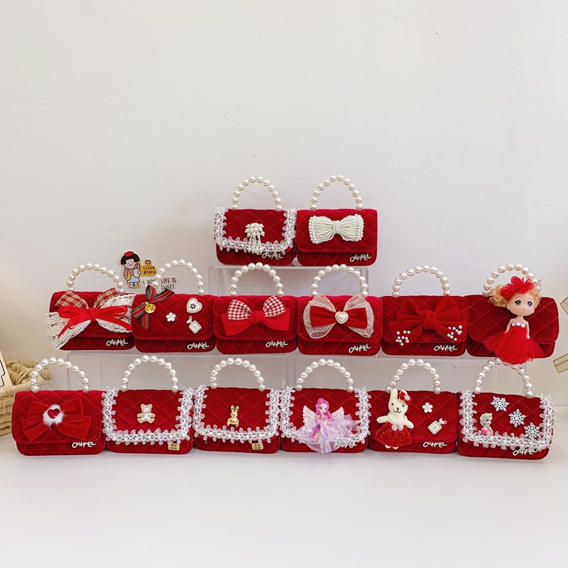 Bolso de niños nuevo bolso de perla rojo de Año Nuevo lindos princesas niñas bolso de hombro de cadena de estilo extranjero bolso de mochila