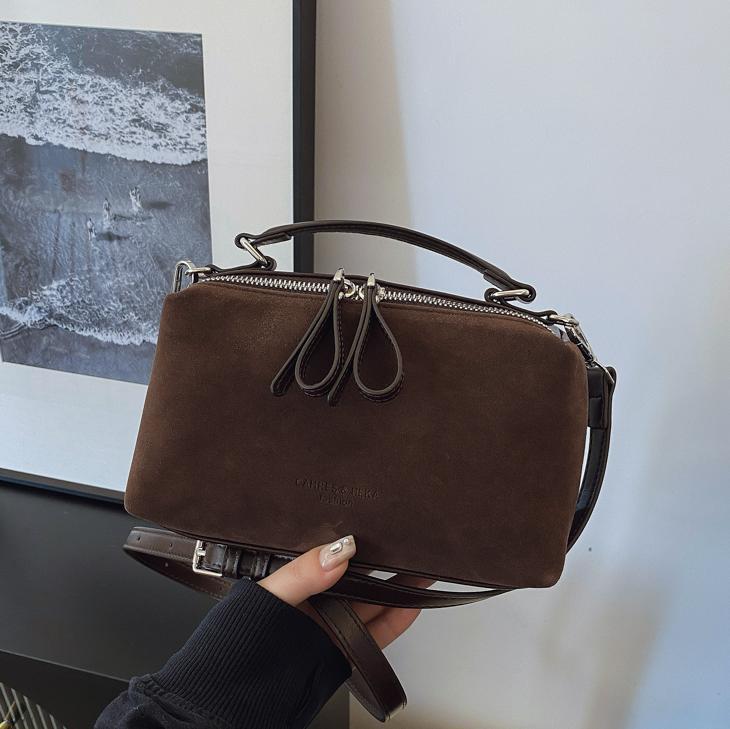 Invierno de moda mochila de textura esmerizada para mujeres 2025 nueva bolsa de hombro de mano casual de alta calidad sensación versátil mochila