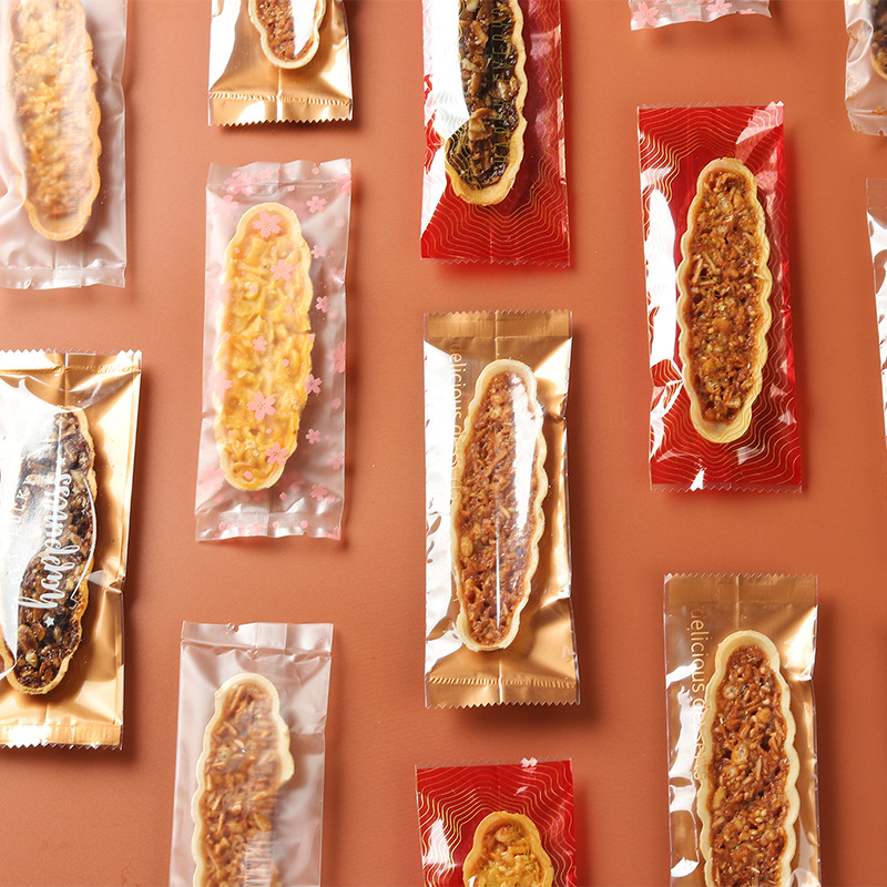 Clásico tipo barco de arroz glutinoso embalaje rectangular máquina de hornear bolsa de sellado en stock fábrica al por mayor bolsa de embalaje de piruletas