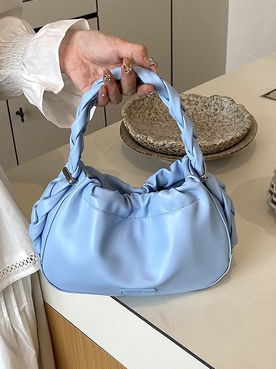 Corea del Sur nueva bolsa de mano plegada mujer 2026 primavera nicho versátil bolso de mochila simple de moda bolsa de nube de viaje