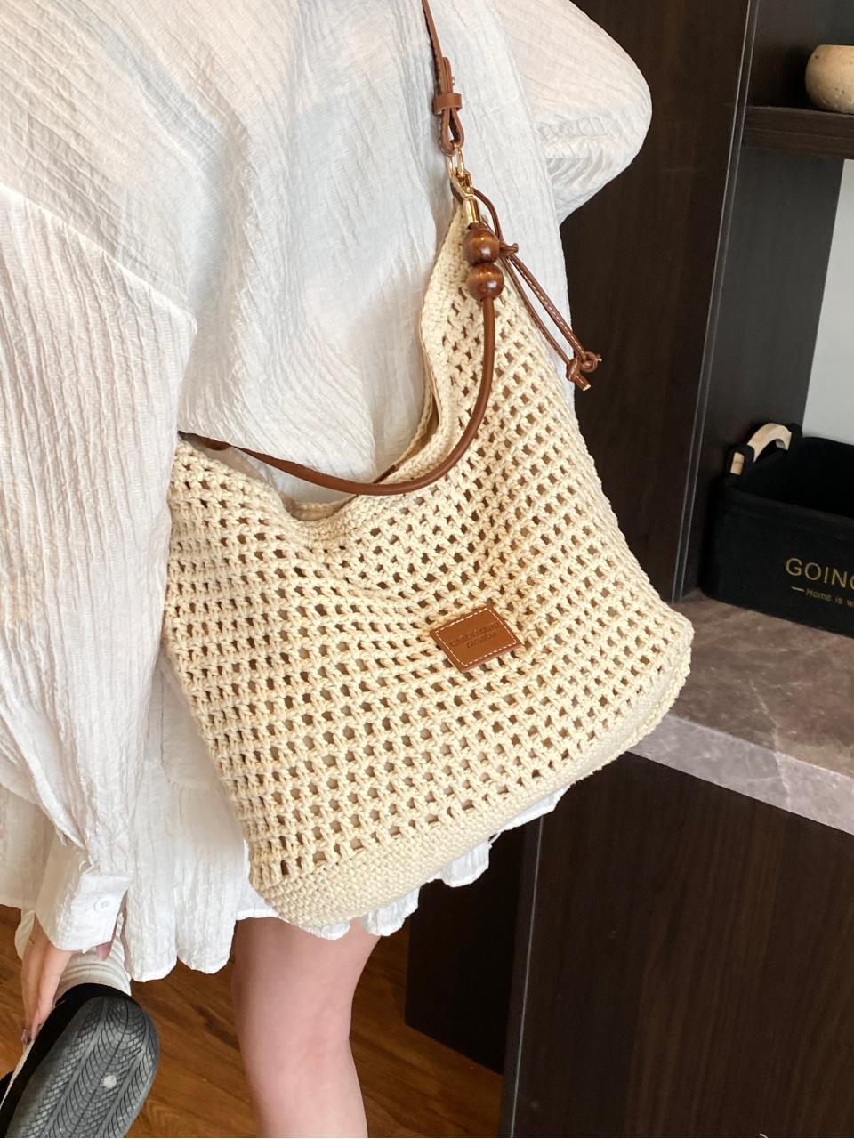 Bolso tejido hueco, verano femenino, nuevo estilo, bolso tejido de paja, bolso de mensajero de un solo hombro de gran capacidad, bolso de playa de vacaciones junto al mar