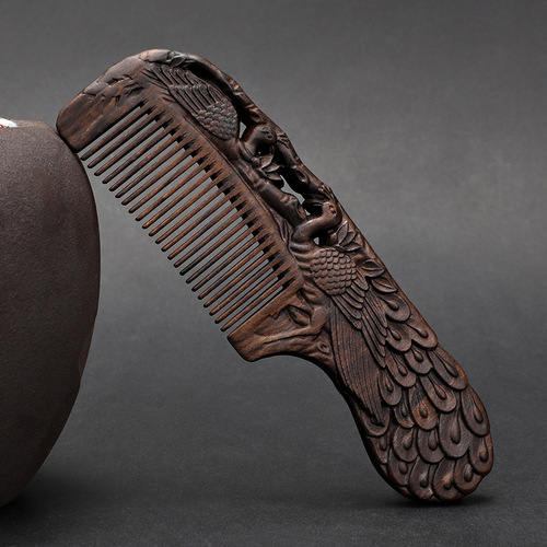A solid wood hair comb with a black sandalwood handle, double-sided carved floral design, fine-toothed, ancient-style gift comb for smooth hair and massage.