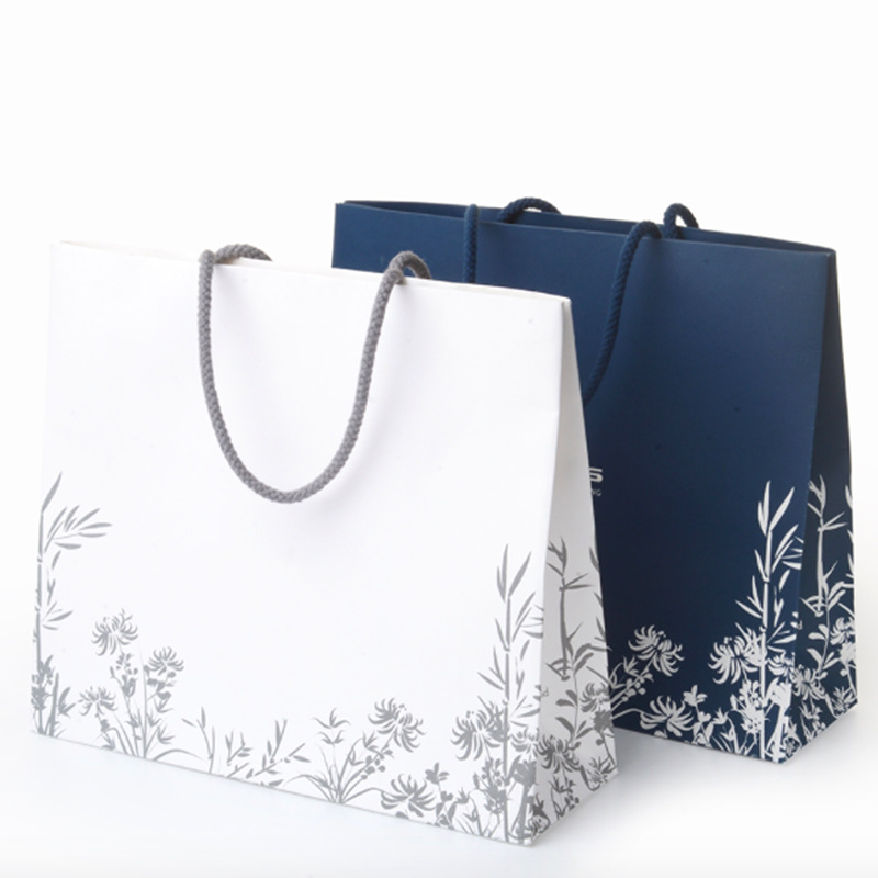 厂家直供手提袋纸袋带纽扣服装包装袋礼品购物袋定制