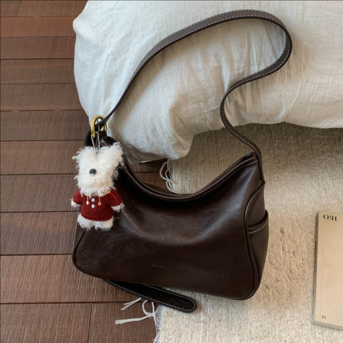 Coreano de cuero suave de alto nivel de hombro bolso de brazo para mujeres 2025 nueva bolsa de transporte de viaje bolsa casual versátil mochila