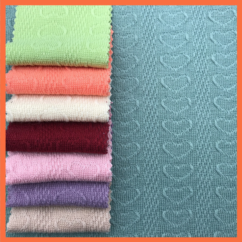 现货毛线粗针提花针织面料 心桃提花面料 宠物服箱包服装面料