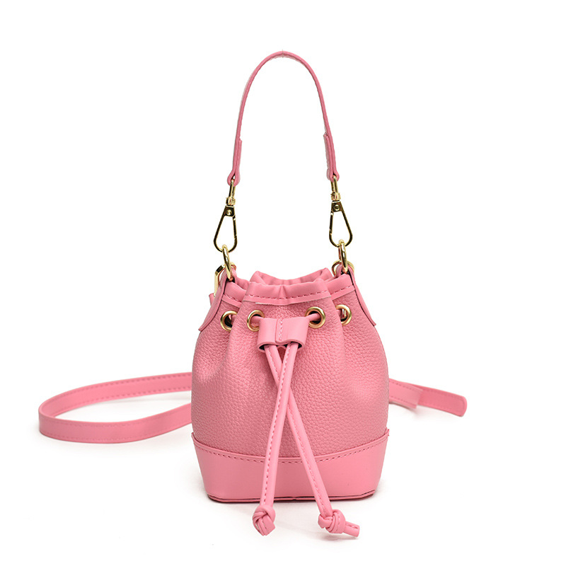 Bolsos de hombro coreanos para niños y niñas de moda estampado de leopardo de color extranjero bolsas de balde de agua para bebés 2025 nuevas bolsas mini para niños