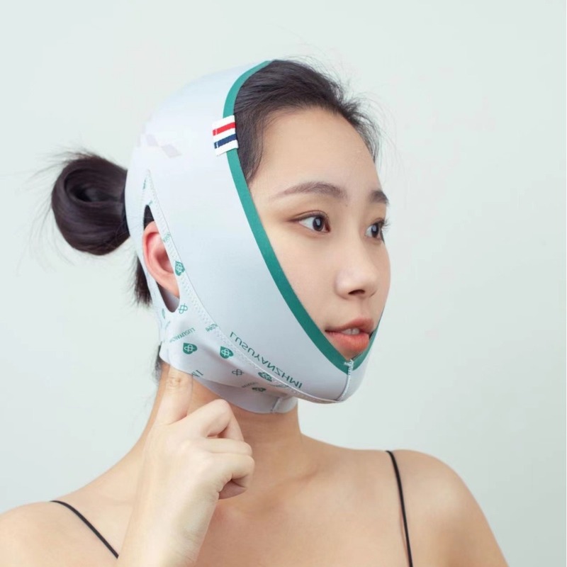 小さな顔の形のやせた顔は法令の紋様の睡眠の包帯のマスクの美容院の面の彫刻を持って引き延ばして線の彫刻のやせた顔を結びます。|undefined