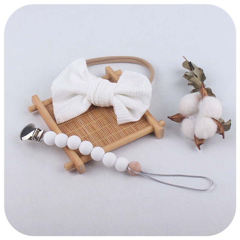 Accesorios para el cabello del bebé de Europa y América del arco de nylon banda para el cabello bebé suministros bebé chupete de silicona pezón anti-caída traje de cadena