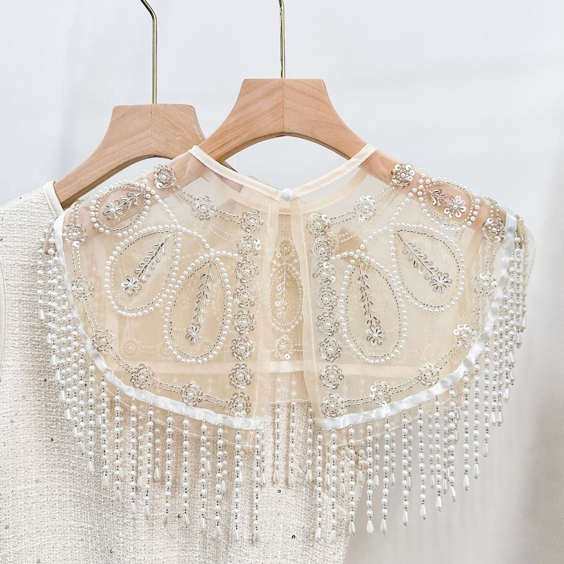 Eslinga de punto hueca de ganchillo para mujer, verano nuevo estilo, costura de bordado, top de borla corta
