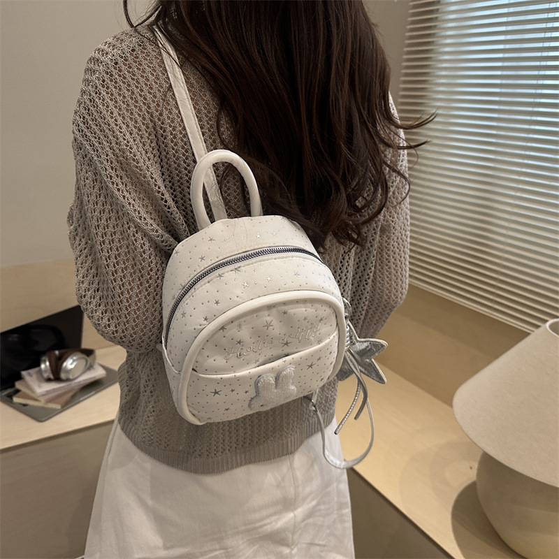 Nicho colegio estilo mochila portátil mujer 2026 nueva moda simple dibujos animados versátil viaje ocio mochila de moda