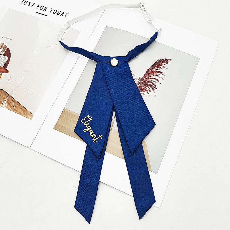 Fabricante spot color sólido jk pajarita versión coreana femenina estilo universitario arco foto de graduación traje de soltero bordado cuello flor serpentina