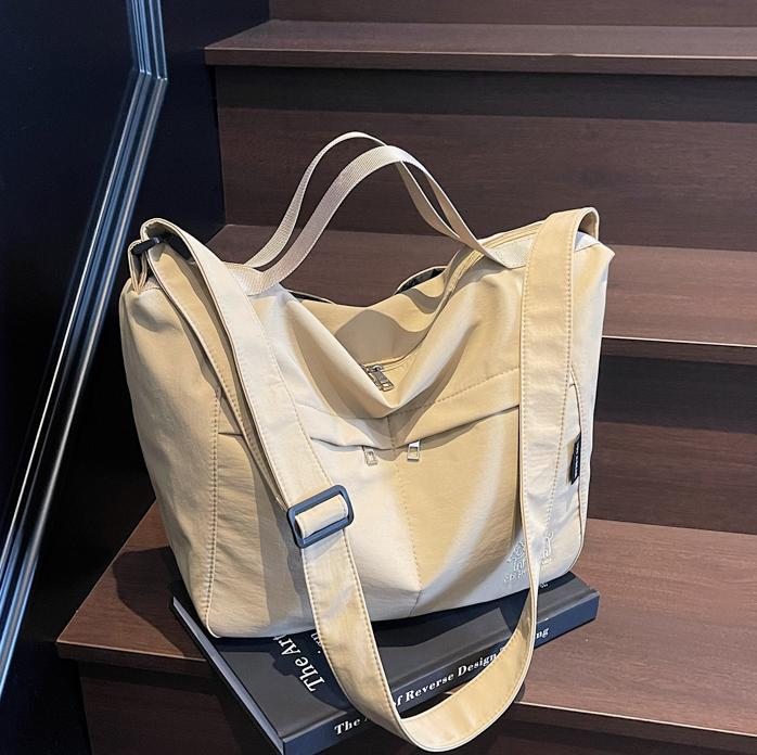 Bolso tote de lona de gran capacidad explosivo transfronterizo 2025 nuevo estilo de clase bolso de mensajero de ocio bolso de viaje femenino