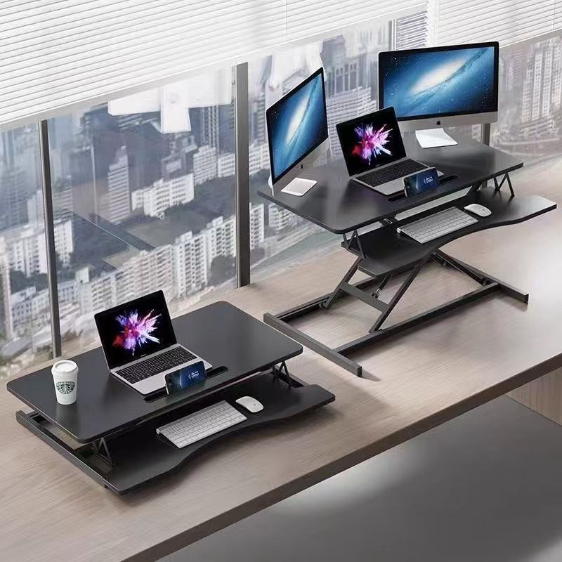 立っているデスクの昇降コンピュータの机の折り畳みの机の上で気動のタイプのデスクトップはノートの小さいテーブルを高く上げます。|undefined