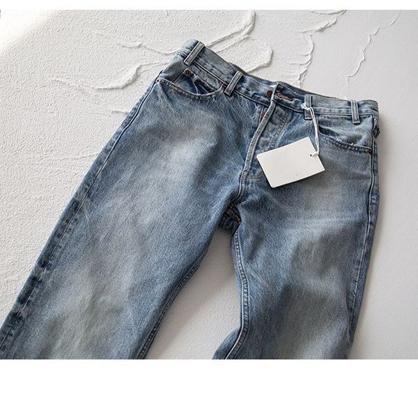 Pantalones vaqueros azules deshilachados de pierna recta americana retro con textura de copo de nieve pantalones casuales para hombres estilo no-501