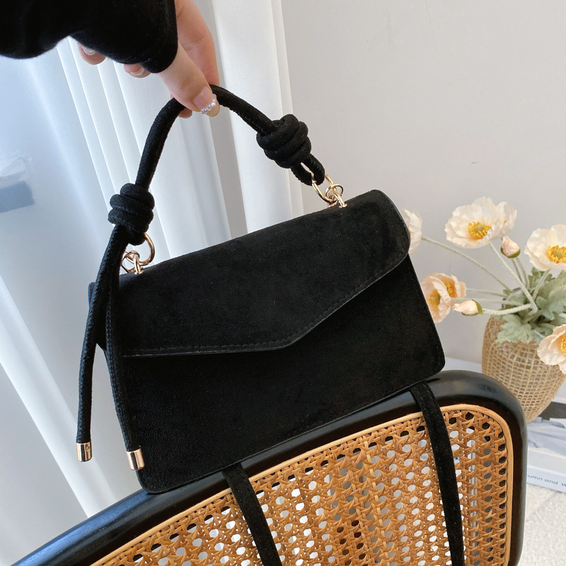 2024 otoño y invierno temperamento diseño de moda de un solo hombro aire extranjero color sólido retro textura simple bolso portátil