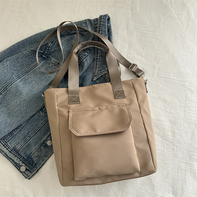 Corea del estilo de transporte universal lona multi-bolsillo TOT estudiantes de arte ocio simple 2025 bolso de hombro portátil
