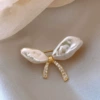 From pearl, with bow