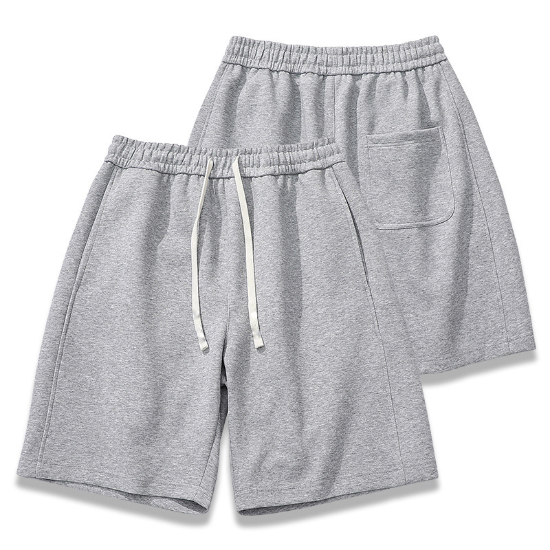 Nuevas tendencias pantalones cortos de cinco puntos de color sólido de verano versión coreana de pantalones deportivos casuales para hombres