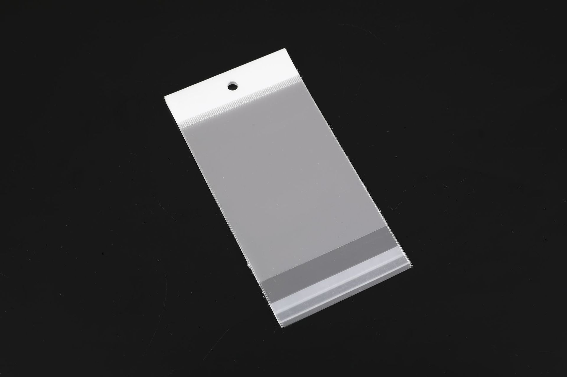 Bolsa autoadhesiva de película nacarada blanca, cabeza de tarjeta transparente, bolsa autoadhesiva de embalaje opp, bolsa de orificio colgante de película de plástico personalizada