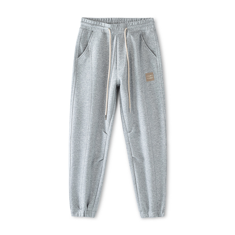 Mick Jones2025 caño hombre pantalones casuales sueltos versátiles estilo coreano de moda pantalones deportivos gris regular