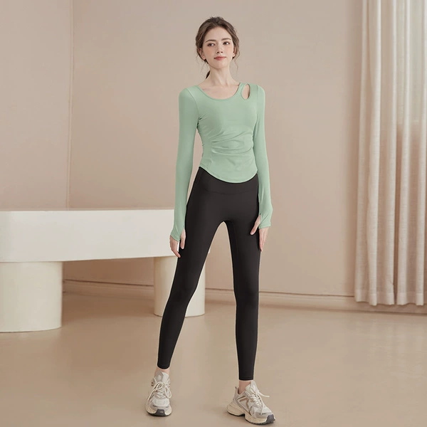 Green long-sleeve, black trousers