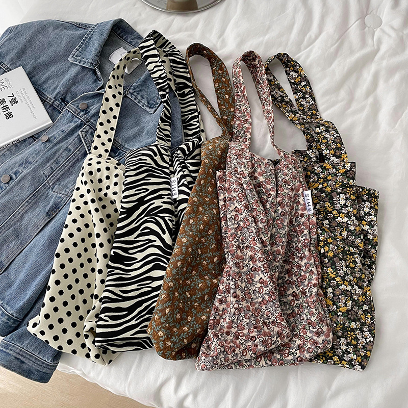 Diseño nicho bolsas de lona para mujeres 2025 nueva gran capacidad coreana estampado de leopardo flor de hombro impresa bolsas de mujer