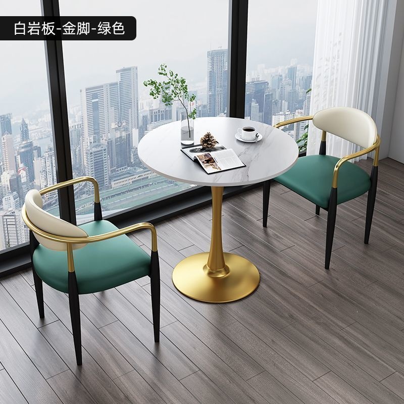 Gold legs + white rock slab + green leather, one table and two chairs