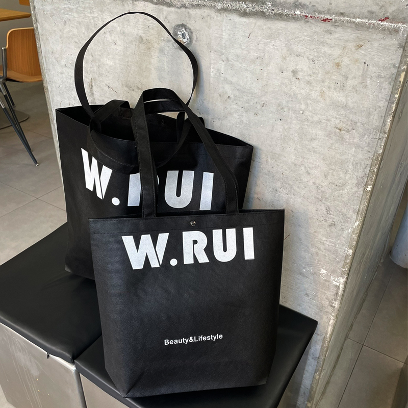 Bolsa de tela no tejida negra para imprimir logotipo de moda de la tienda de ropa de mujer bolsa de publicidad de compras