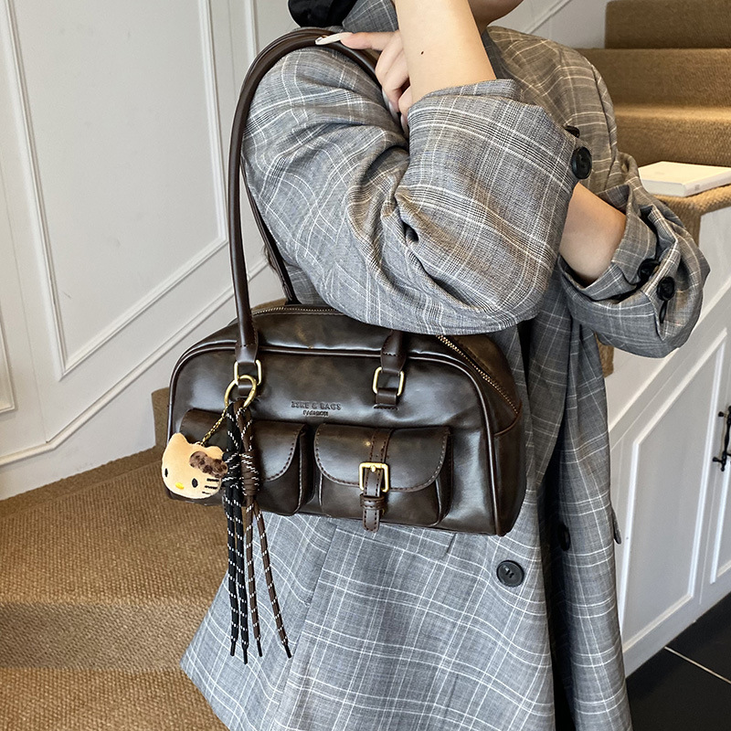 Bolsa de almohada portátil simple coreana transfronteriza para mujeres otoño / invierno 2025 nuevo retro versátil bolso de hombro bolso de brazo de viaje