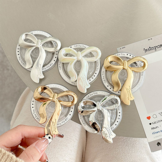 Magnetic suction phone case airbag bracket South Korea ins style retractable portable metal bow back sticker for stable carry-on