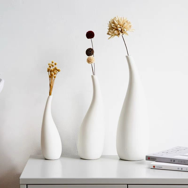 北欧風のシンプルな陶磁器の花瓶の置物の白い色の乾燥した花を焼いて家庭の装飾の飾り物のメーカーの卸売りを挿します。