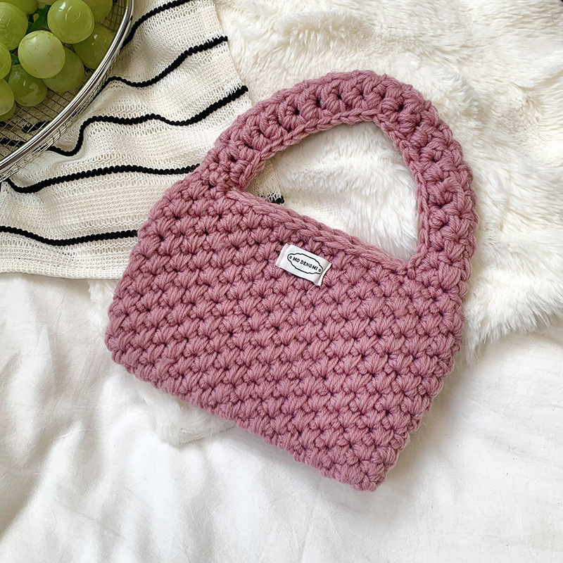 Bolsa de mano de damas de otoño y invierno 2025 nuevo estilo simple ganchillo a mano lana tejido bolsas de hombro al por mayor