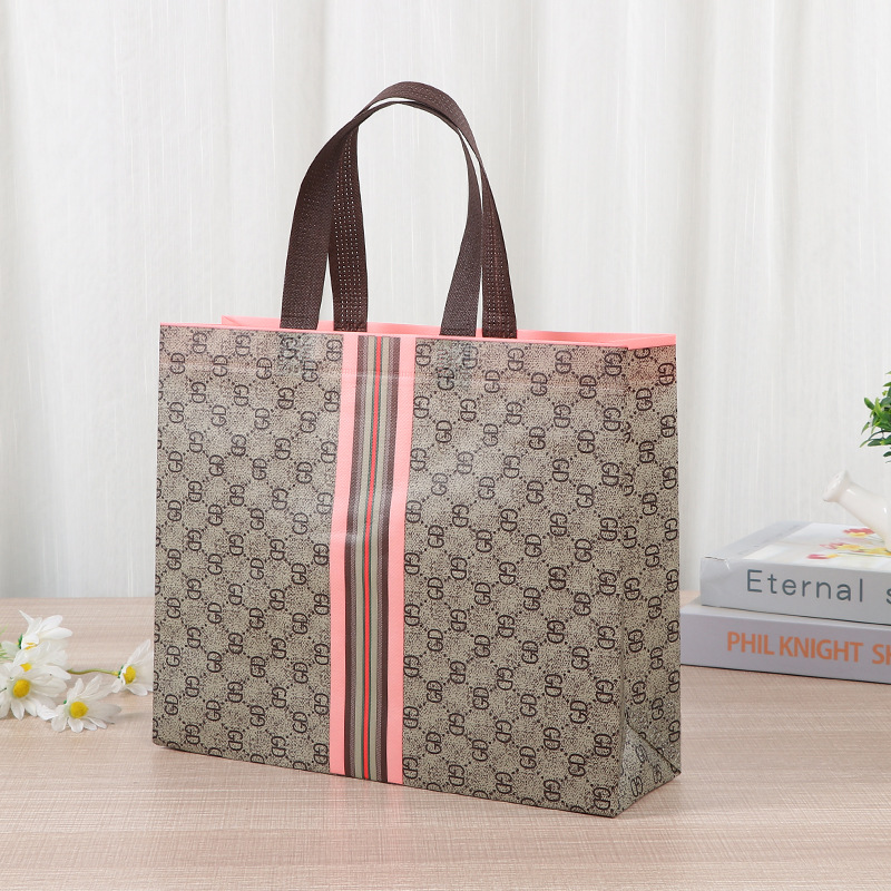 Bolsa de tela no tejida portátil gruesa bolsa de embalaje tridimensional resistente al desgaste de gran capacidad de equipaje de dormitorio de estudiantes bolsa de mano