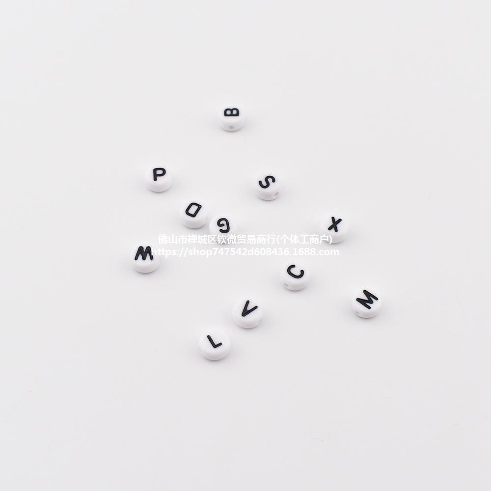 White acrylic beads with letters