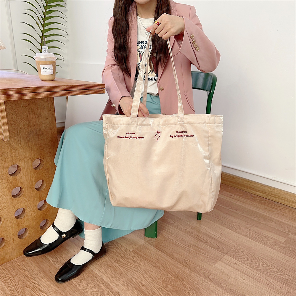 44284 large-capacity double-sided embroidered bow, sweet tote bag, single-shoulder cloth bag, canvas schoolbag for girls Item Picture