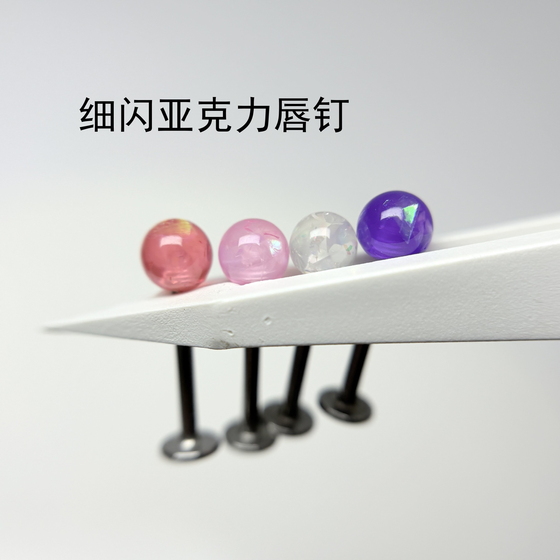 Silver pointed spike labret stud material detail