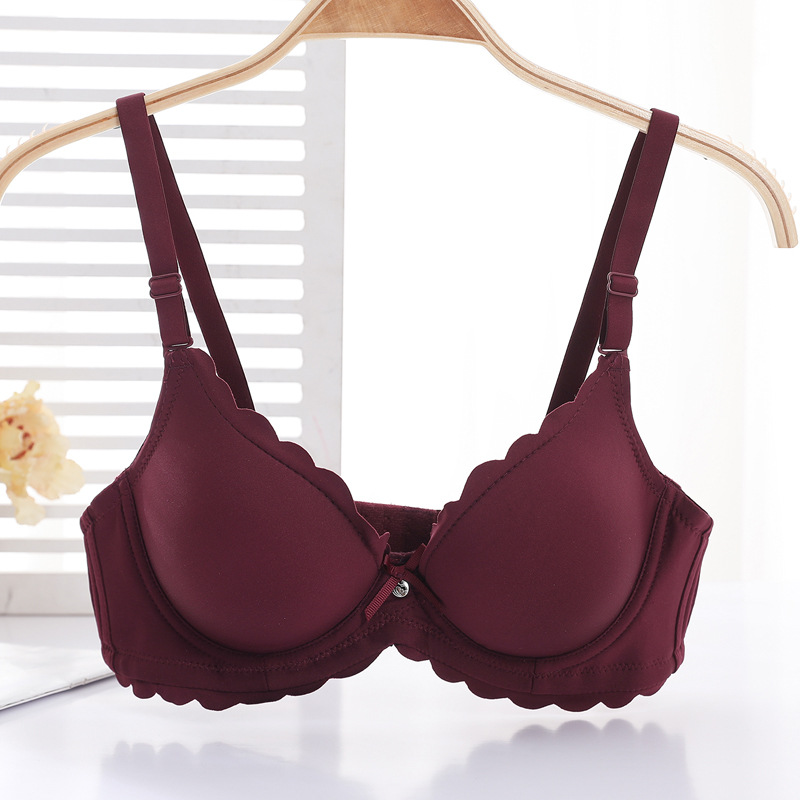 Fábrica de sujetadores de Shantou en stock brillante sin marcas de grosor pequeño sujetador de ropa interior para mujeres ajustable soporte superior para evitar caída