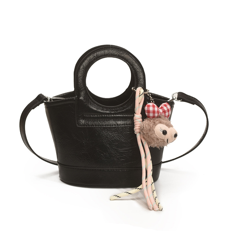 Bolso para mujeres 2026 nuevo nicho coreano de comida de mano cesta bolsa de cubo de textura alta de viaje mochila de hombro