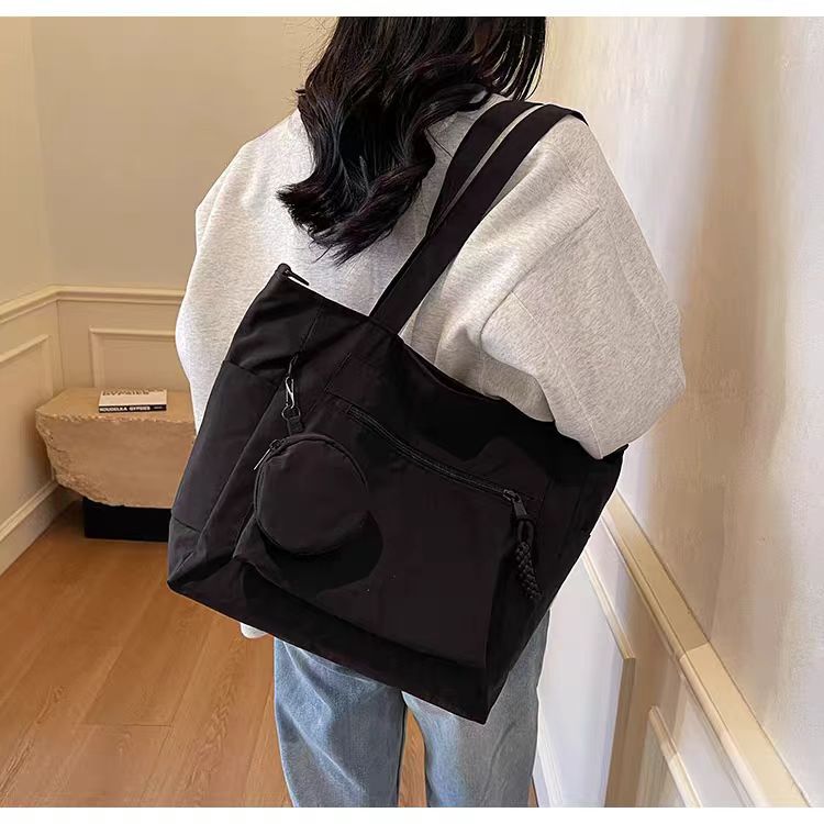 Transfronterizos casuales de color sólido nylon bolso de mano nueva bolsa de tela de transporte de gran capacidad simple y ligera mochila de hombro