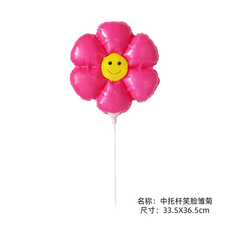 太陽の花の笑顔の花の風船は手を持って小さいデイジーの露店を持ってひまわりのアルミニウムの膜を押して空の卸売りの花を漂っています。|undefined