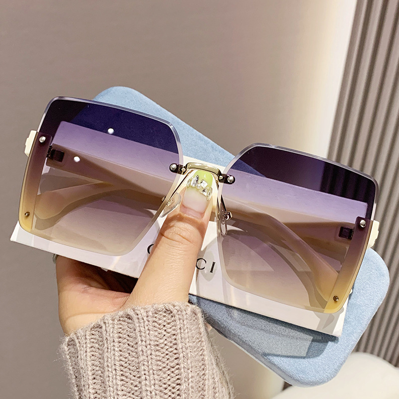 Nuevas gafas de sol de moda de alta calidad sin marco de borde de corte de las mujeres gafas de sol de gran marco a prueba de rayos UV gafas de sol de moda