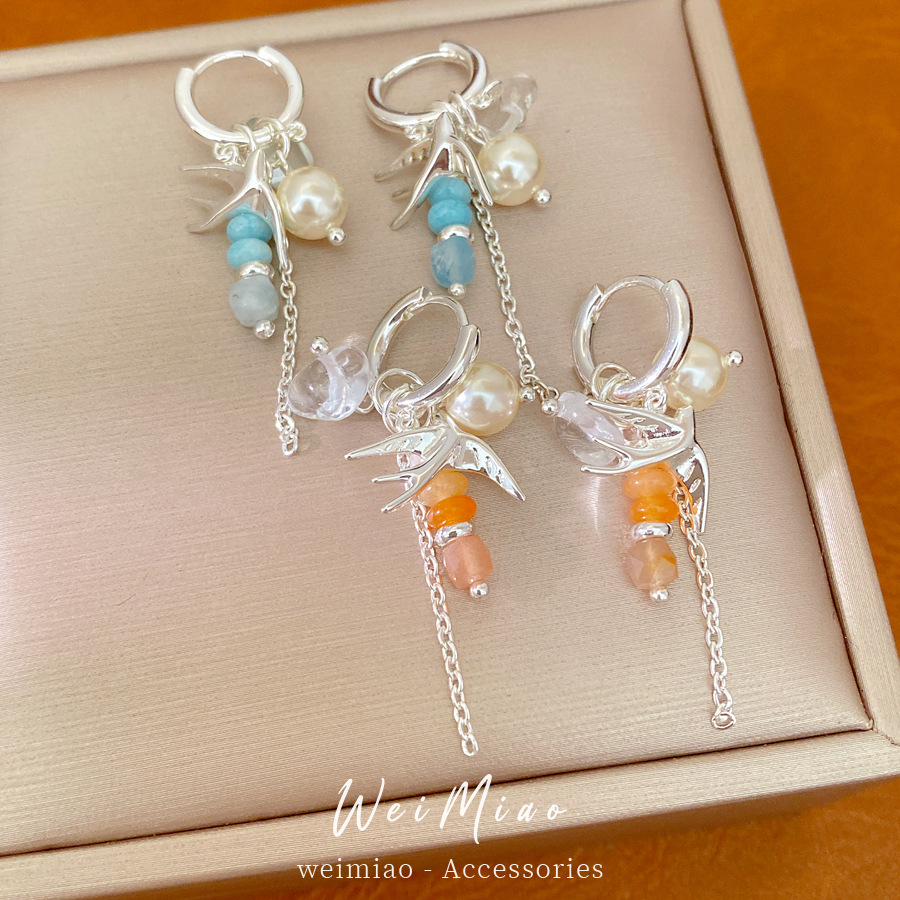 Accesorios de vacaciones golondrina perlas perlas auriculares temperamento nicho de moda aretes ligeros de lujo alta sensación auriculares al por mayor