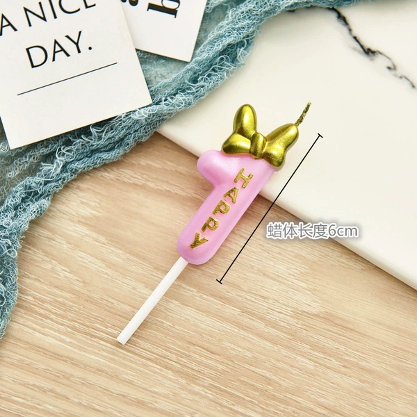 Fuchsia candle with bow